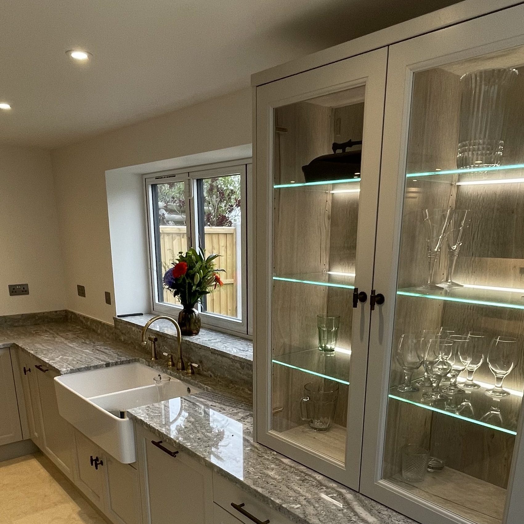 Shaker-style kitchen with glass cabinets